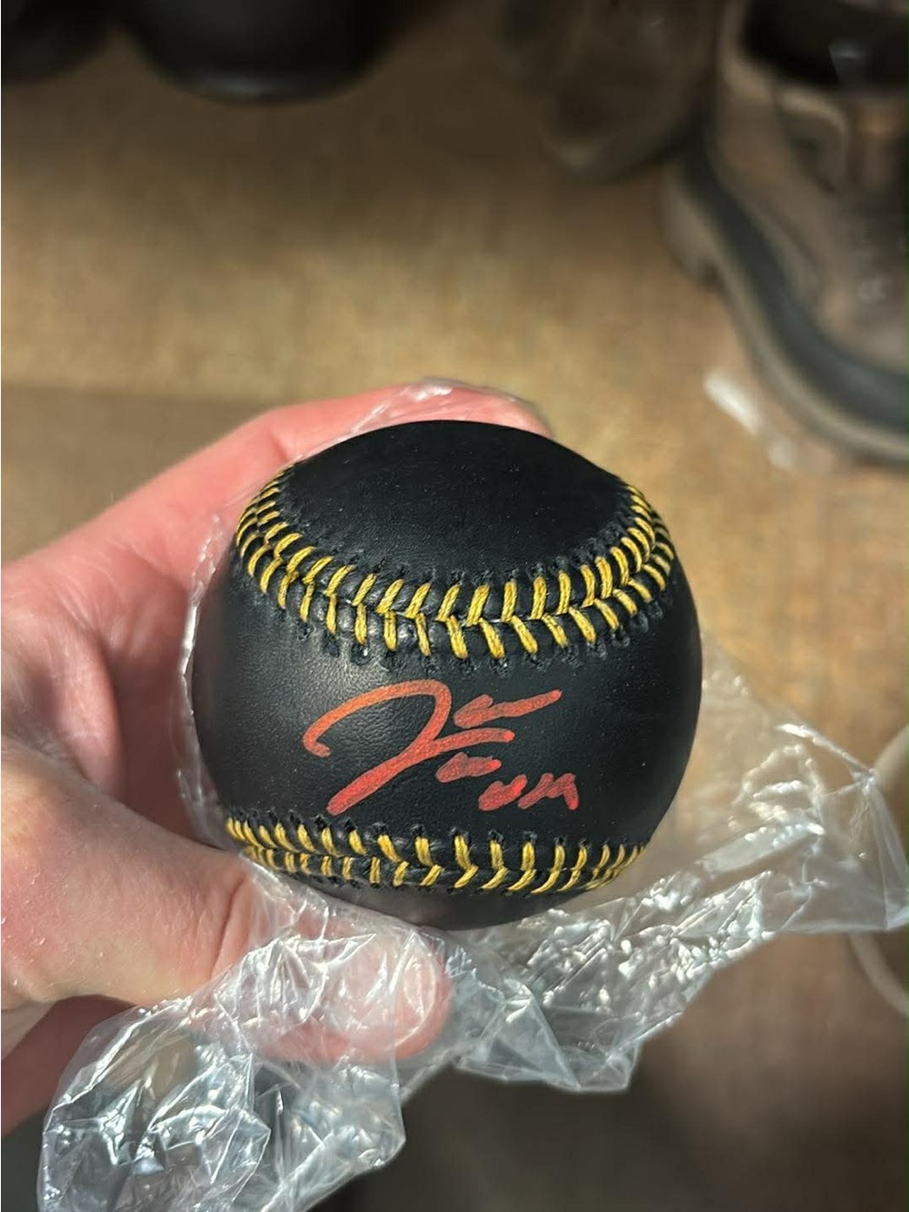 MLB Black Leather Baseball with Yellow Stitching and Red Signature
